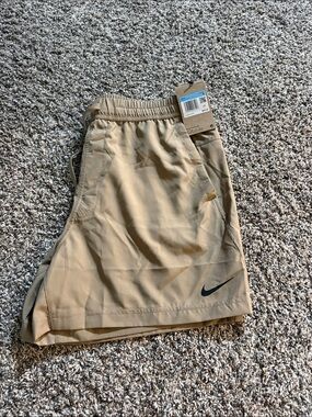 Nike Men's Khaki Athletic Shorts with Black Swoosh